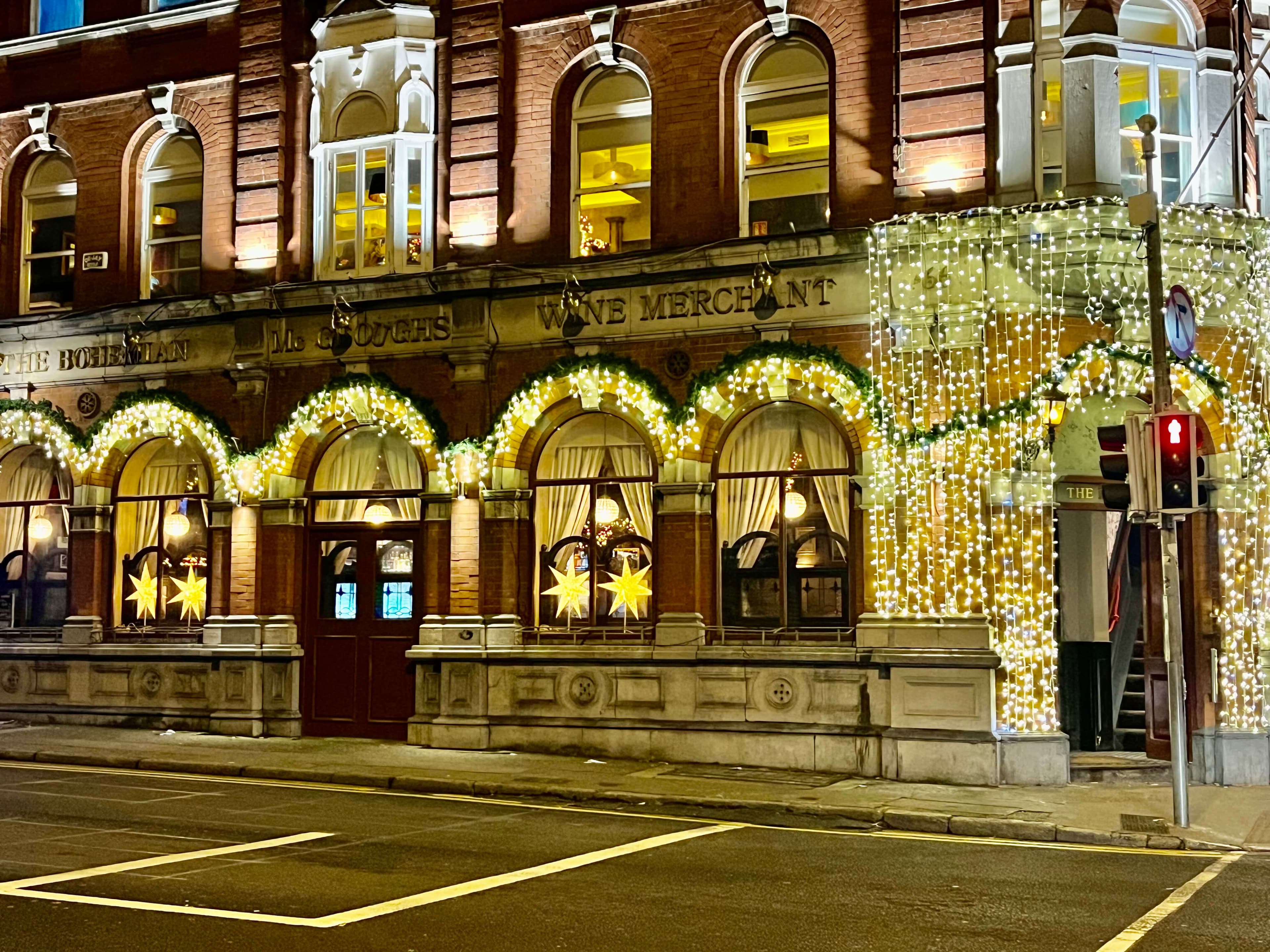 Bohemian Pub exterior on Phibsborough Road lit with Christmas lights at night