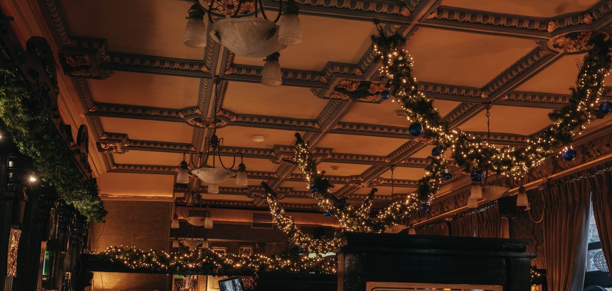 The ornate Victorian ceiling of Bohemian Pub — original plasterwork, painstakingly restored
